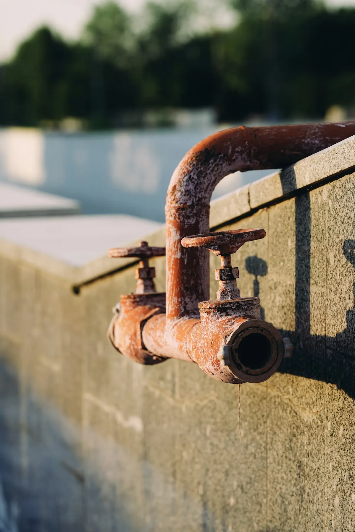 Corroded pipework and valves on an industrial site